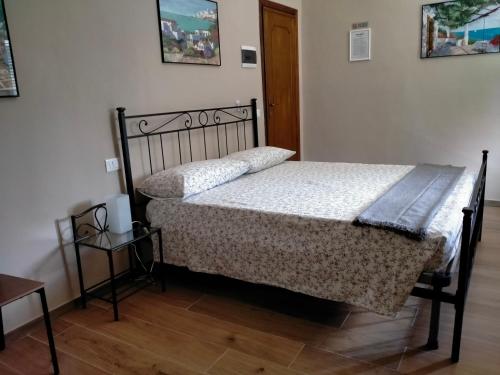 a bedroom with a bed and a wooden floor at il Cantuccio in Lucca