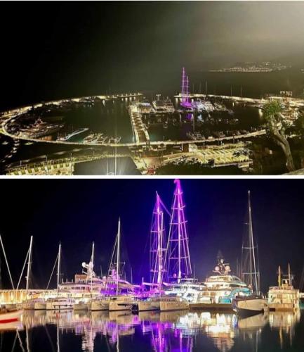 two pictures of a marina with boats in the water at night at Affittacamere L'Orchidea in Ventimiglia