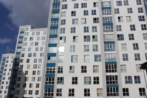 a tall white building with many windows at KAT11 in Beylikduzu