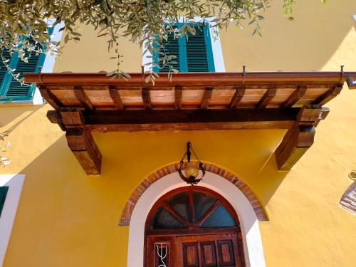 a building with a wooden roof over a door at il Cantuccio in Lucca