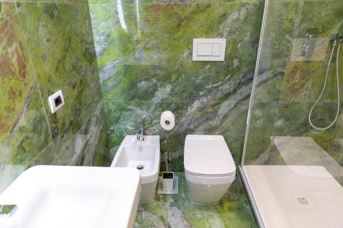a bathroom with a toilet and a sink at B&B The View all'Acquedotto in Rome