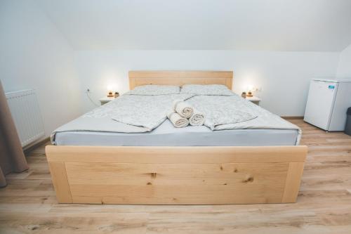 a bed in a bedroom with two towels on it at Apartma pri Boštjanu in Škofja Loka