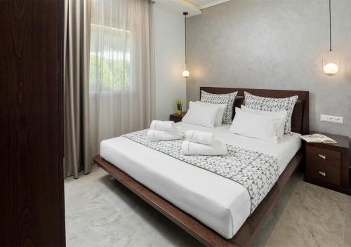 Katil atau katil-katil dalam bilik di SUN RESIDENCE Exclusive Seaside Suites