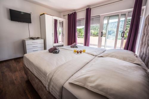 Ένα ή περισσότερα κρεβάτια σε δωμάτιο στο Villa JULIJA