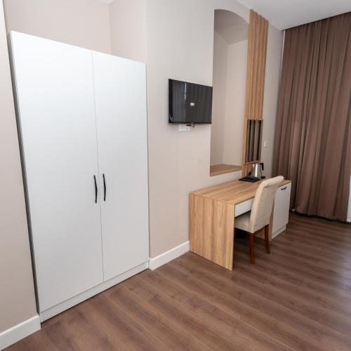 TV a/nebo společenská místnost v ubytování OLF Hotel
