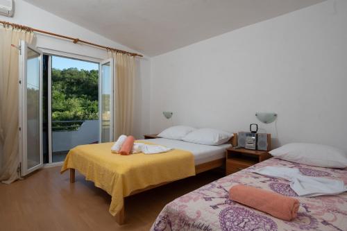 Posteľ alebo postele v izbe v ubytovaní Marina's Apartments