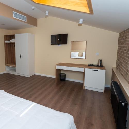 Postel nebo postele na pokoji v ubytování OLF Hotel