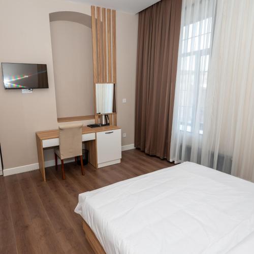 Postel nebo postele na pokoji v ubytování OLF Hotel