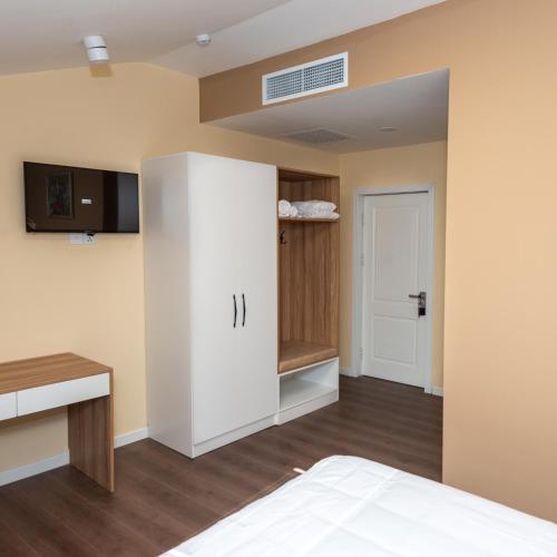 Postel nebo postele na pokoji v ubytování OLF Hotel