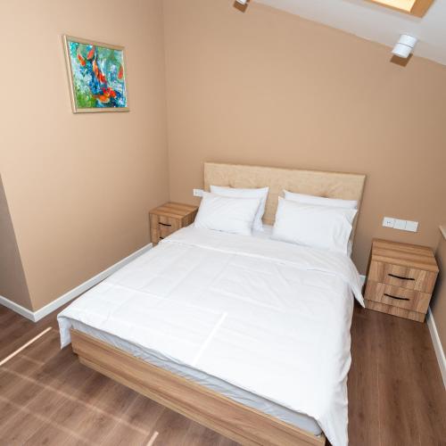 Postel nebo postele na pokoji v ubytování OLF Hotel