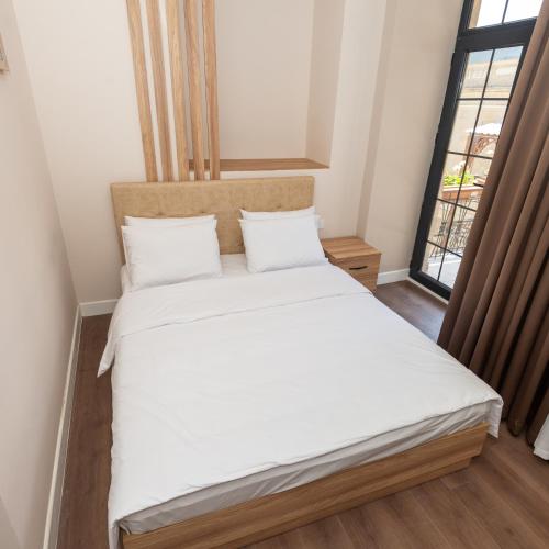 Postel nebo postele na pokoji v ubytování OLF Hotel