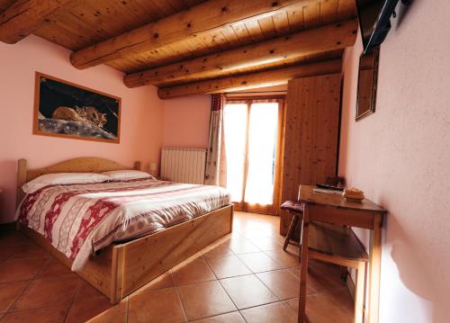 Ένα ή περισσότερα κρεβάτια σε δωμάτιο στο Agriturismo Belotti