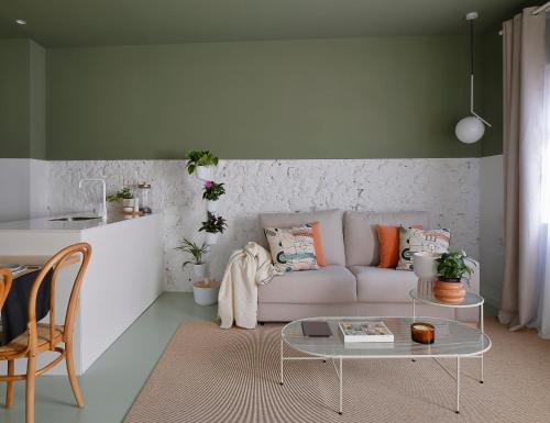 a living room with a couch and a table at Apartamento diseño Galiana 6 Avilés Asturias in Avilés