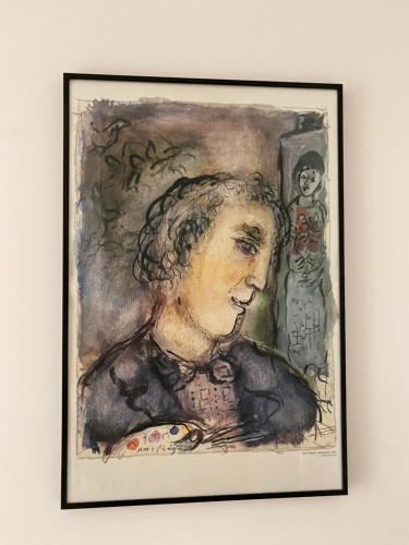 a drawing of a woman in front of a mirror at Holiday home "225 Marc Chagall" in Mandelieu-la-Napoule