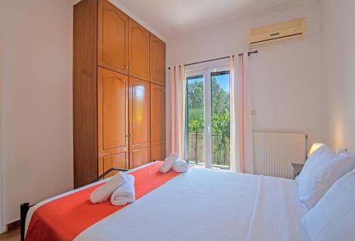 Ένα ή περισσότερα κρεβάτια σε δωμάτιο στο Kallithea House