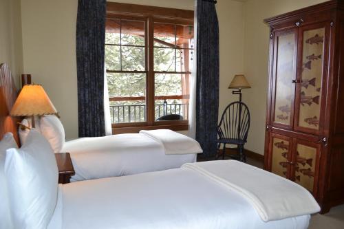 A bed or beds in a room at Teton Club