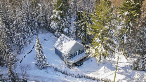an aerial view of a house in the snow at Chalet Le Convivial Tremblant in Lac-Superieur