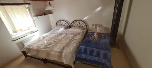 En eller flere senge i et værelse på Semplice casa