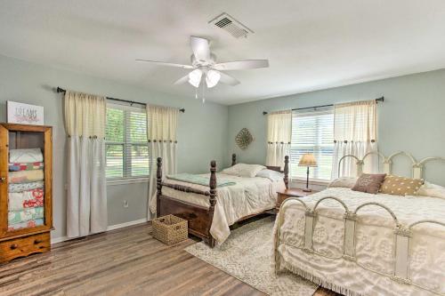 a bedroom with two beds and a ceiling fan at Grans Getaway - Peaceful Texas Retreat 