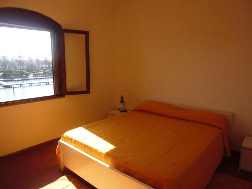 Ένα ή περισσότερα κρεβάτια σε δωμάτιο στο LGVacanze 8 posti letto