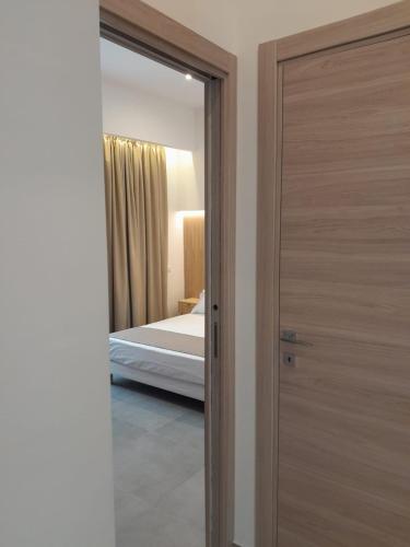 Katil atau katil-katil dalam bilik di BAARIA House Hotel