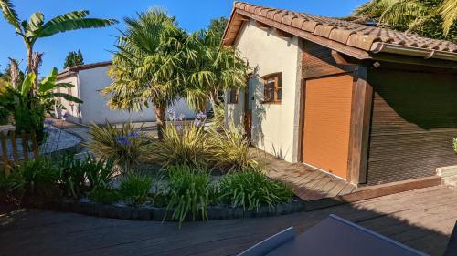 Photo de la galerie de l'établissement Guest House au milieu des palmiers, à Saint-Martin-de-Seignanx