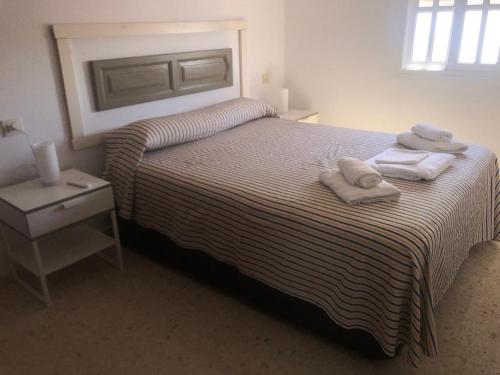 A bed or beds in a room at Sanpau