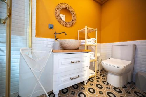 a bathroom with a white sink and a toilet at ROOT TINY HOUSE KALKAN in Kaş
