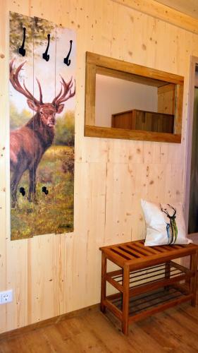 a room with a painting of a deer on the wall at WaldBlick im Happy Allgäu - Wohnung mit großer Dachterrasse in Leutkirch im Allgäu