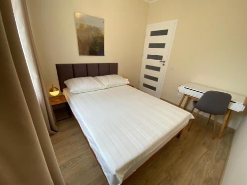 Posteľ alebo postele v izbe v ubytovaní Apartament Aleja Centrum Białystok