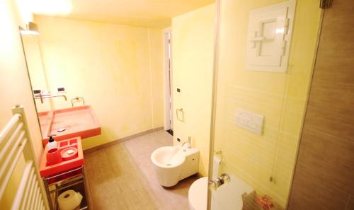 a small bathroom with a sink and a toilet at Due Papi in Savona