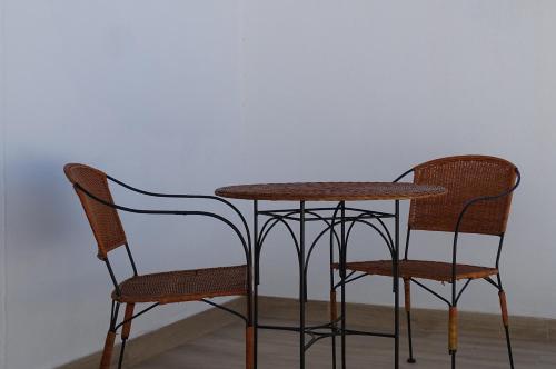 two chairs and a table and a table and chairs at Casazul M&B in Cercal