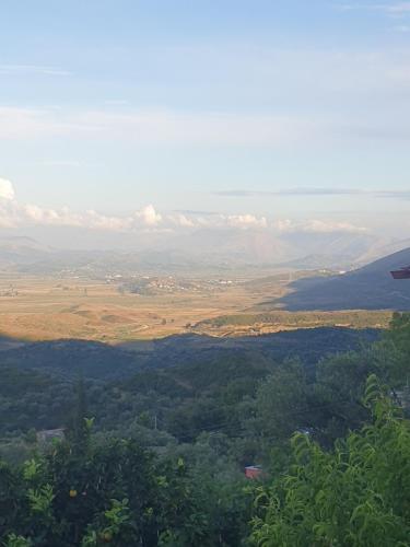 a view of a valley with trees and mountains at Rosemary House in Sarandë