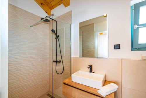 a bathroom with a sink and a shower at HACIENDA GASPAROVIC in Sukošan
