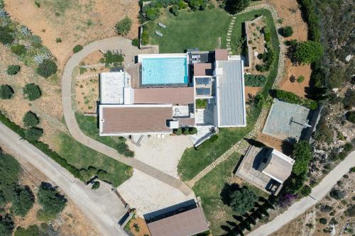 an overhead view of a house with a swimming pool at Villa Dei Sogni, for the Design Lovers,By ThinkVilla in Agia Pelagia