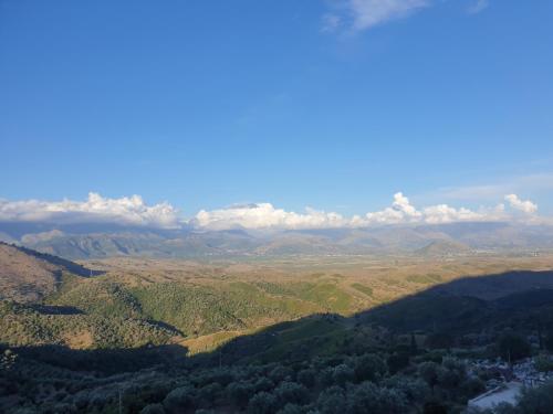 an aerial view of a valley with mountains and forests at Rosemary House in Sarandë