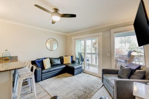 a living room with a couch and a table at Sea Cabin 121-B in Isle of Palms
