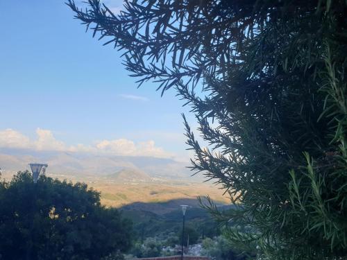 a view of a valley with mountains in the distance at Rosemary House in Sarandë