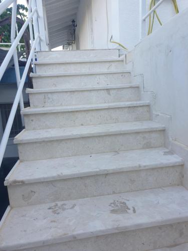 a set of stairs in front of a house at Rosemary House in Sarandë