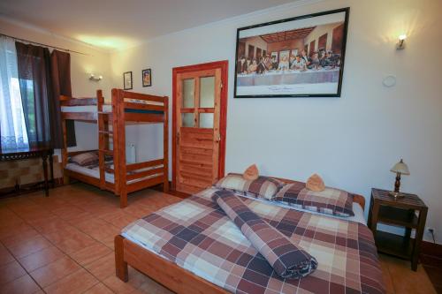 a bedroom with a bed and a bunk bed at Everlast in Štúrovo