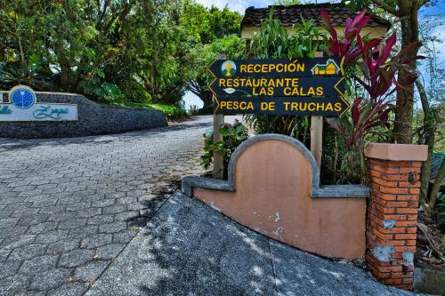 a sign for aresociationustainableolisolisolisolisolisolisolisolisincial at Hotel Villa Zurqui in San José