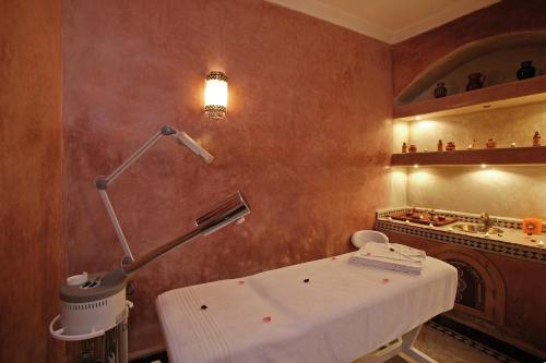 a hospital room with a table and a lamp at Riad & Spa Esprit Du Maroc in Marrakech