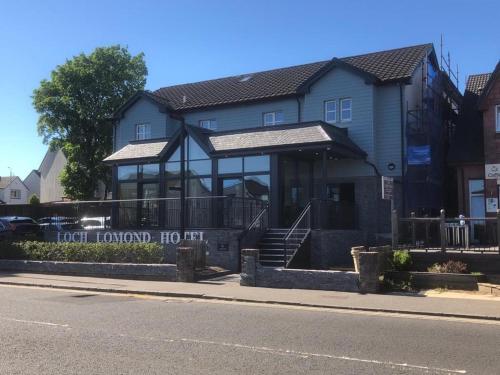a house on the side of the street at Loch Lomond Hotel in Balloch