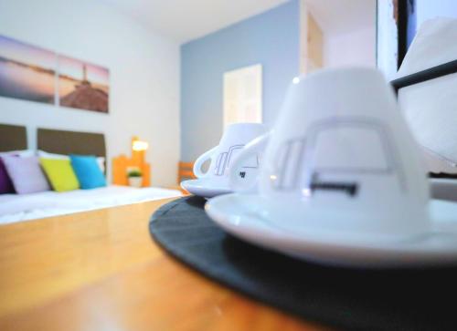 two white appliances sitting on a table in a bedroom at Malia Boutique Studios in Malia