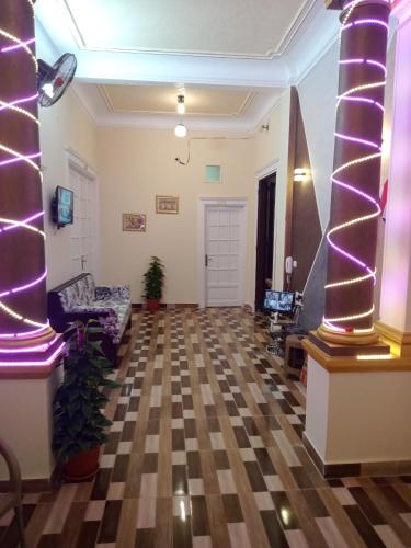 a living room with a checkered floor at New One Hotel in Cairo