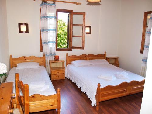 Postel nebo postele na pokoji v ubytování Olga Studios