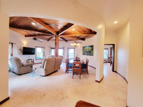 a living room with a table and chairs at Indigo Belize 1B Condo in San Pedro