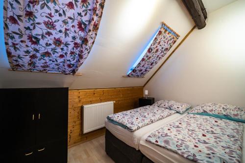 Postel nebo postele na pokoji v ubytování Dum Slunicko