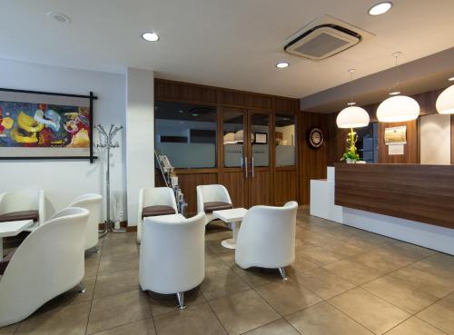 Χώρος καθιστικού στο Cit'Hotel Stim'Otel