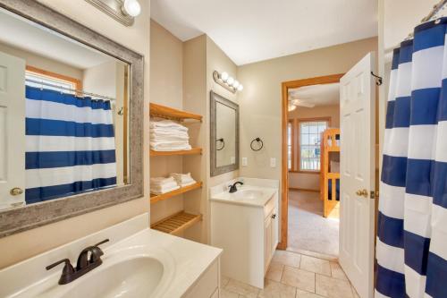 a bathroom with a sink and a mirror at Deja Blue 917 in Frisco